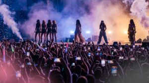 Silhouetted performers on stage symbolizing cultural influence without constant visibility