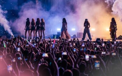 Silhouetted performers on stage symbolizing cultural influence without constant visibility