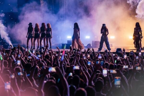 Silhouetted performers on stage symbolizing cultural influence without constant visibility