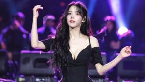 IU performing on stage during a live concert
